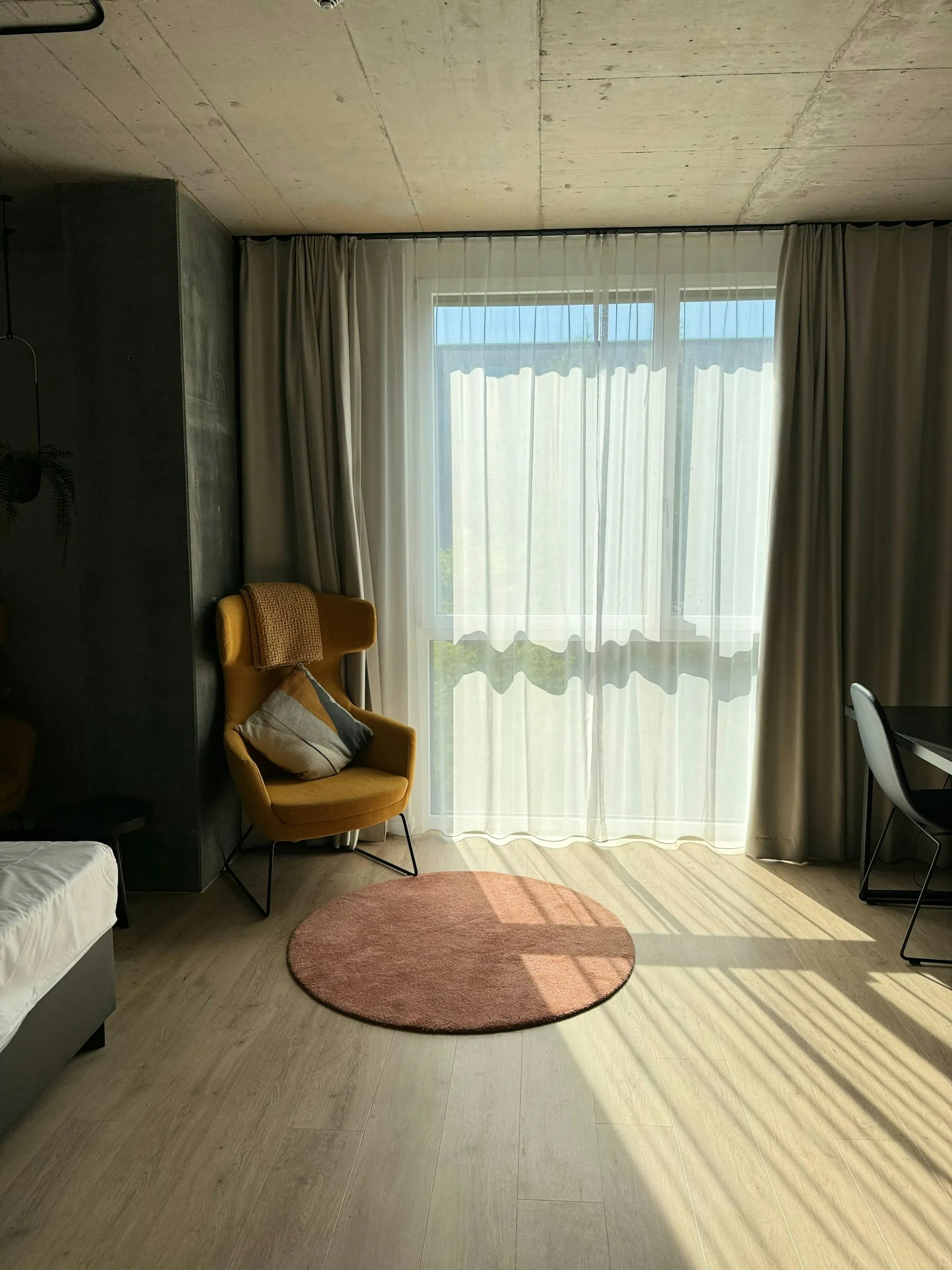 Modern boutique hotel room with natural light and design elements