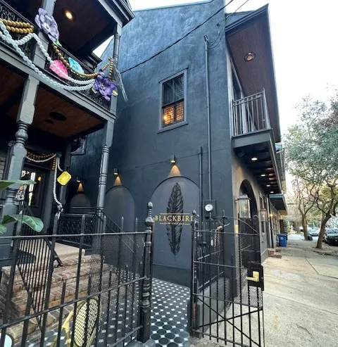 Exterior of The Blackbird Hotel in New Orleans with chilled pool