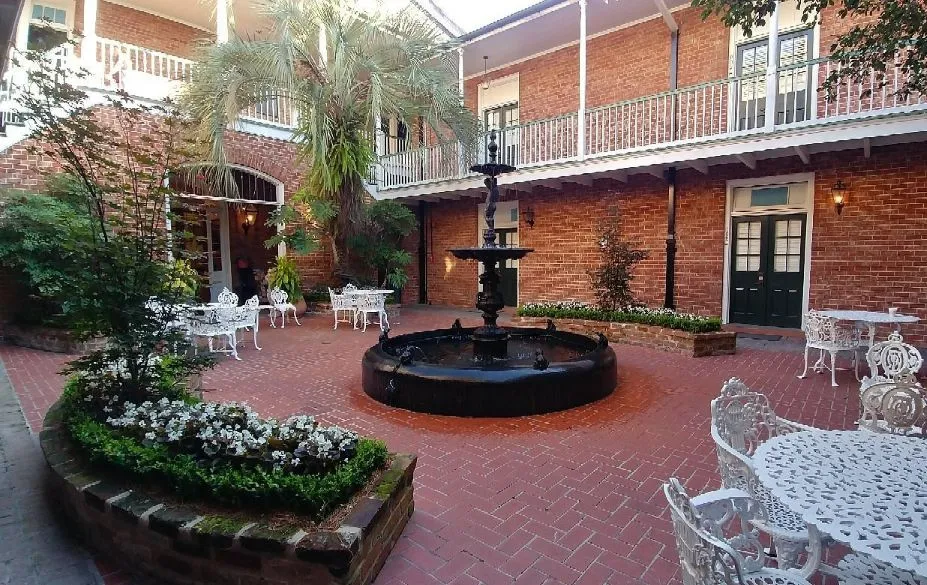 Hotel Provincial riad-style courtyard with fountain and wrought iron furniture, French Quarter New Orleans